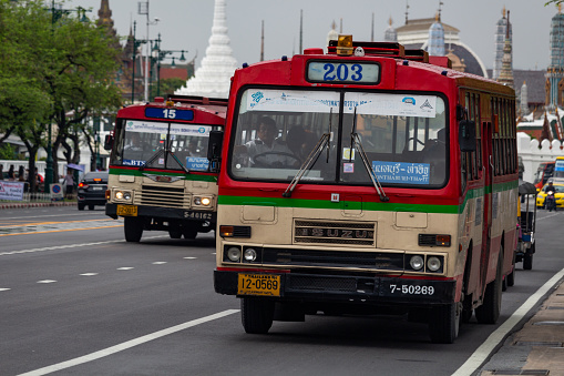 Bangkok, Thailand - April 30, 2018: Vintage style bus driving through the streets of bangkok