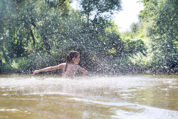istock Girl playing in the water. 1010188536
