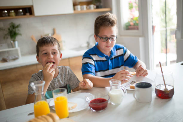 istock Happy kids having healthy breakfast 1010190996