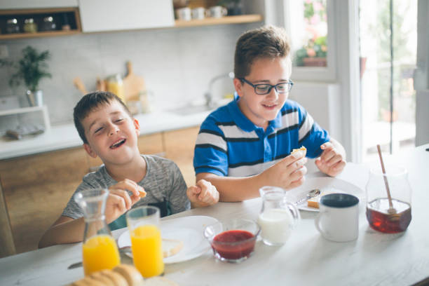 istock Happy kids having healthy breakfast 1010191078