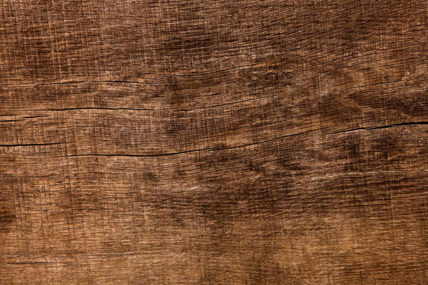 istock Dark wooden texture. Wood brown texture. Background old panels. Retro wooden table. Rustic background. Vintage colored surface. 1010191318