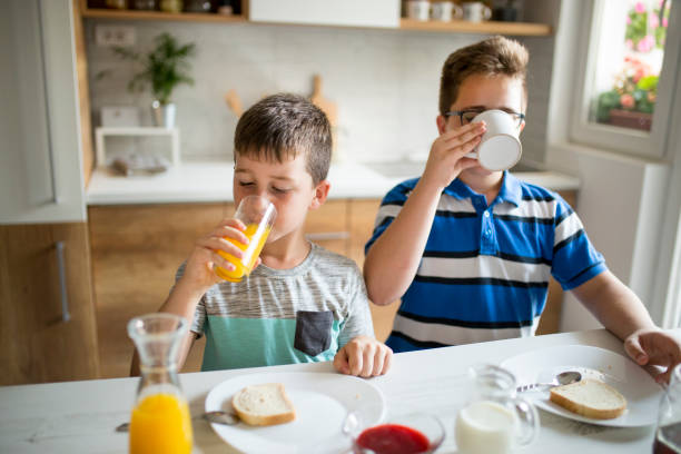istock Happy kids having healthy breakfast 1010191338