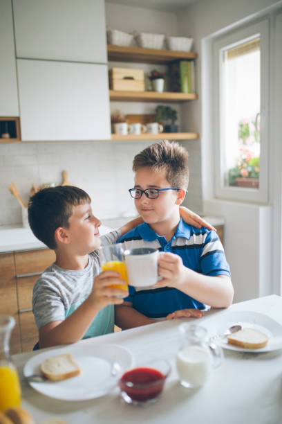 istock Happy kids having healthy breakfast 1010191718