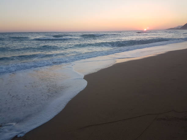 istock sunset sea waves and  foam splash  in summer Preveza Vrahos Greece 1010197740