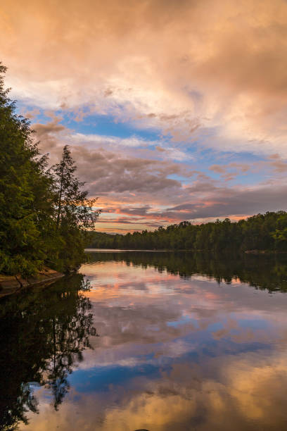 istock Shoreline of a lake under a colorful evening sky 1010198504