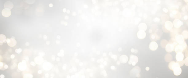 istock Christmas light background.  Holiday glowing backdrop. Defocused Background With Blinking Stars. Blurred Bokeh. 1010207842