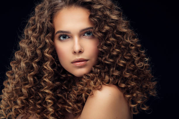 istock Beautiful model with long curly hair 1010208254