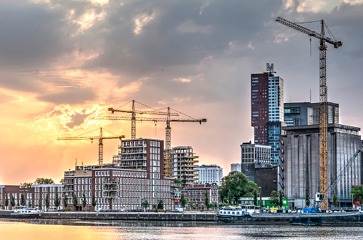 Rotterdam, The Netherlands, July 16, 2018: several construction cranes are transforming the neighbourhood of Katendrecht