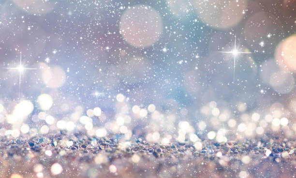 istock Christmas light background.  Holiday glowing backdrop. Defocused Background With Blinking Stars. Blurred Bokeh. 1010215916