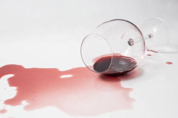 Spilled Red Wine Spilled red wine out of glass on white surface wine glass knocked over stock pictures, royalty-free photos & images