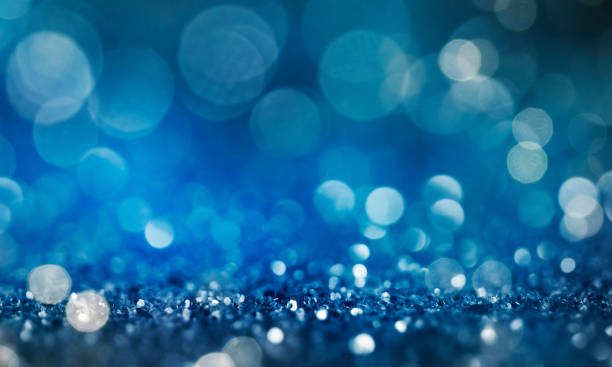 istock Christmas light background.  Holiday glowing backdrop. Defocused Background With Blinking Stars. Blurred Bokeh. 1010221664