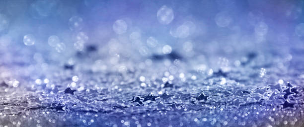 istock Christmas Background.  Holiday glowing Abstract Glitter Defocused Background With Blinking Stars. Blurred Bokeh 1010230666