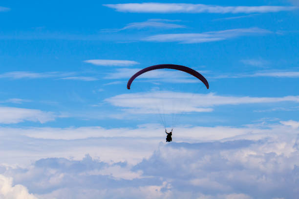 istock Active lifestyle, extreme hobbies. Skydiver flight against the blue sky. 1010231466