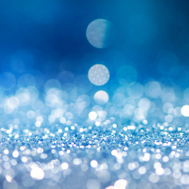 istock Christmas light background.  Holiday glowing backdrop. Defocused Background With Blinking Stars. Blurred Bokeh. 1010237646