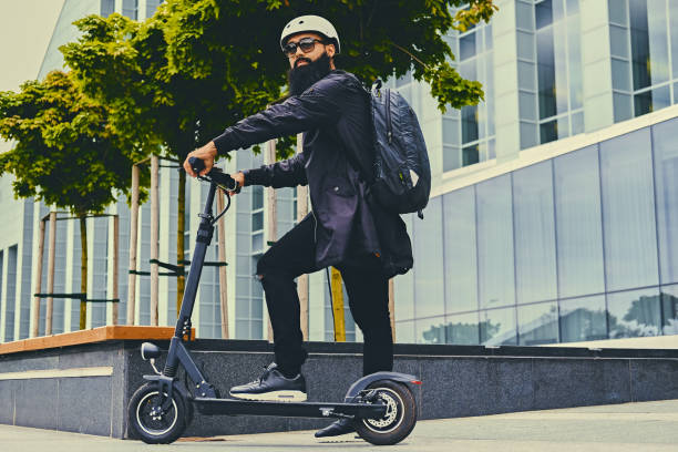 istock A man posing on electric scooter. 1010245160