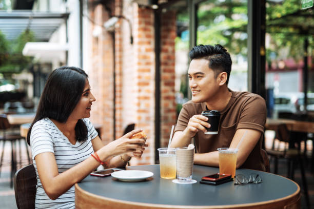 istock Multi ethnic couple in the restaurant having breakfast together 1010249740