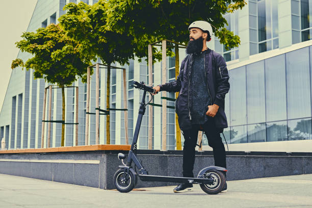 istock A man posing on electric scooter. 1010252660