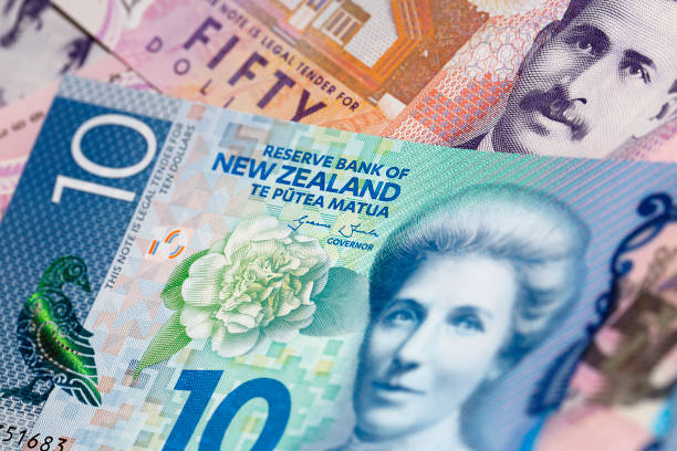 New Zealand Currency Close up of a New Zealand ten dollar bill over some fifty dollar bills - money background with selective focus. new zealand dollar photos stock pictures, royalty-free photos & images