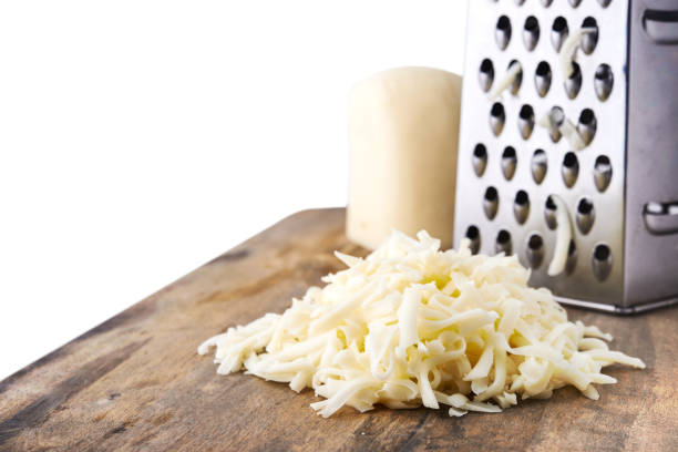 heap of grated mozzarella cheese - recipe ingredient grater cheese grater imagens e fotografias de stock