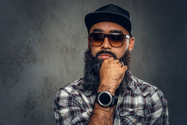 istock Black bearded male posing over grey background. 1010258328