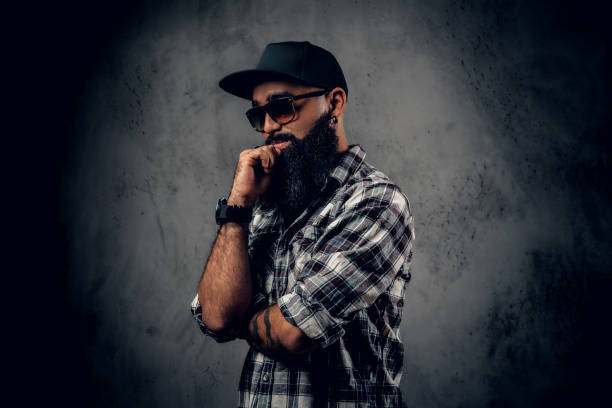 istock Black bearded male posing over grey background. 1010258422