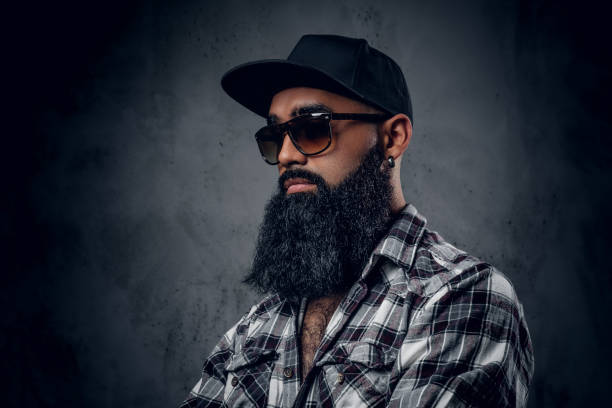 istock Black bearded male posing over grey background. 1010258814