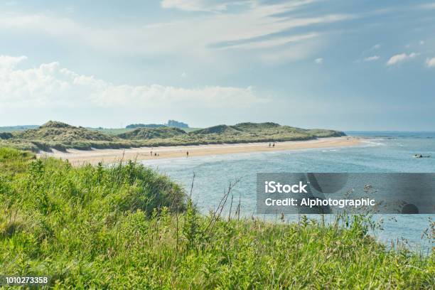 North Sunderland Beach Stock Photo - Download Image Now - Bamburgh Castle, England, Northumberland