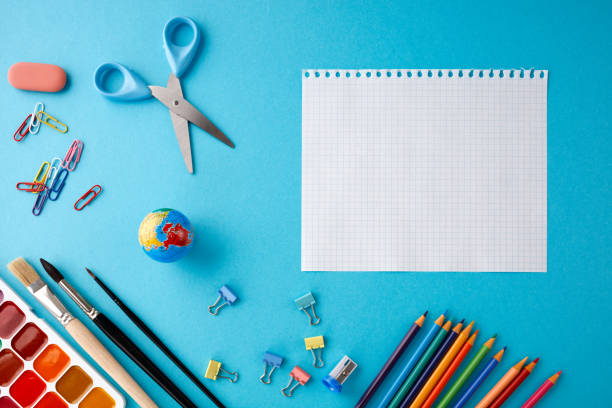 istock Back to school concept on blue texture paper background. 1010281516