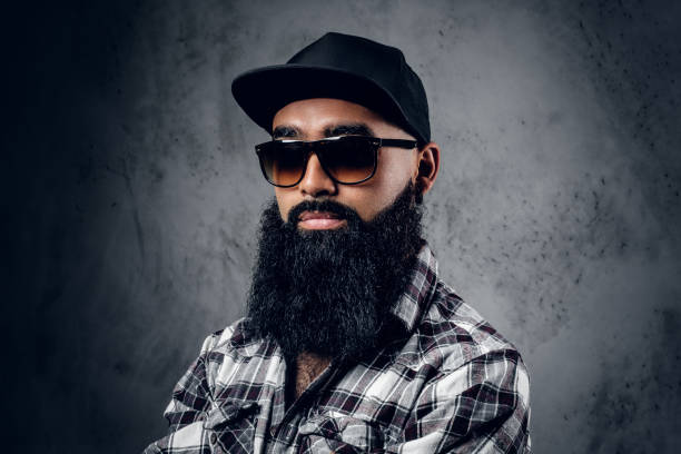 istock Black bearded male posing over grey background. 1010281592