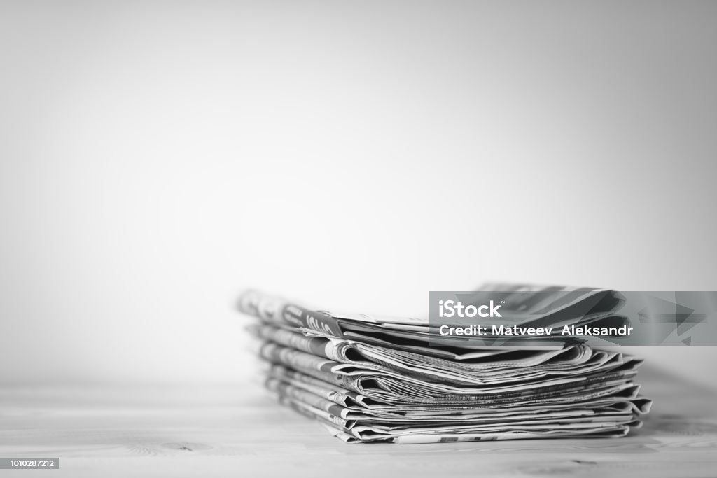 Newspaper on wooden table Newspaper Stock Photo