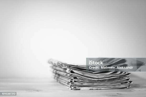 Newspaper On Wooden Table Stock Photo - Download Image Now - Newspaper, Newspaper Headline, The Media