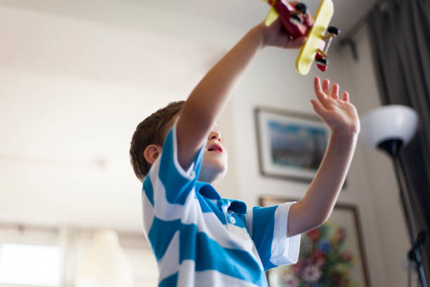 istock child playing with wooden wooden airplane model 1010287270