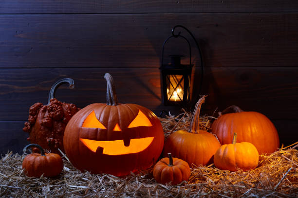 istock Halloween pumpkin jack lantern in dark barn, holiday concept 1010289550