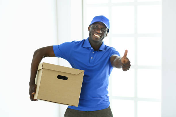 portrait of an handsome happy deliverer with box - delivery van imagens e fotografias de stock