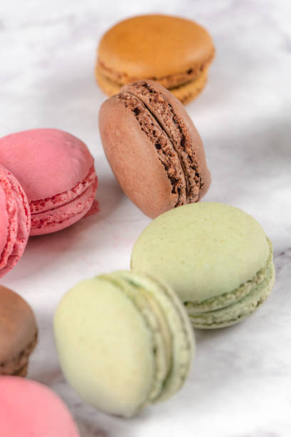 istock Colorful macaroons on stone table. Sweet macarons 1010308686