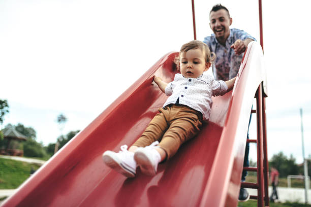 istock Father with little boy on the playground 1010308882
