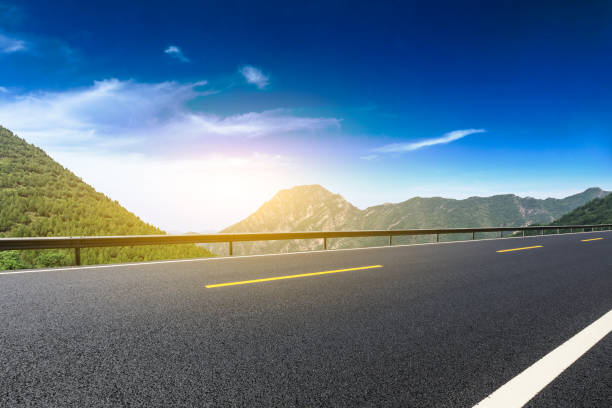 istock Asphalt road and mountains natural scenery at sunrise 1010311576