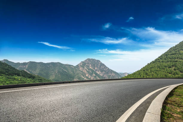 istock Asphalt road and mountains natural scenery under the blue sky 1010311606
