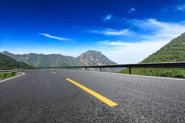 istock Asphalt road and mountains natural scenery under the blue sky 1010311720
