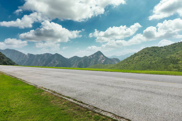 istock Asphalt road and mountains natural scenery under the blue sky 1010316354