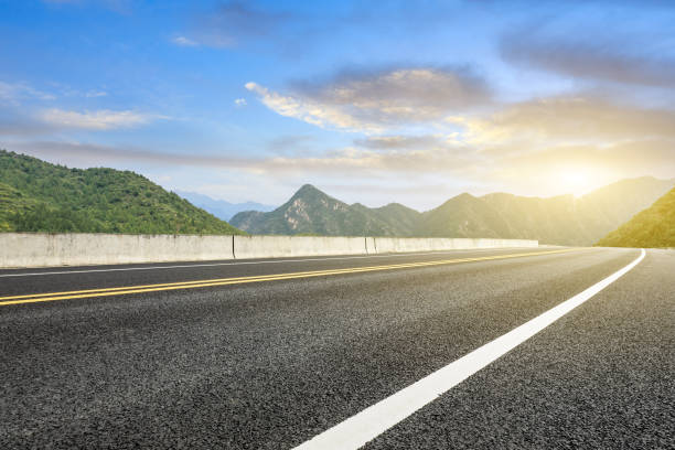 istock Asphalt road and mountains natural scenery at sunrise 1010316358