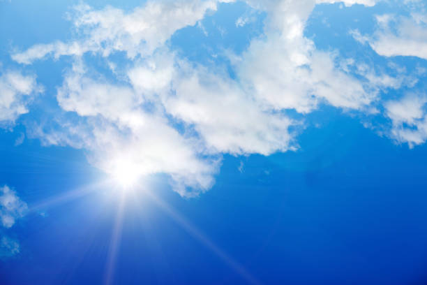 istock clouds against a blue sky with rays of the sun 1010326852