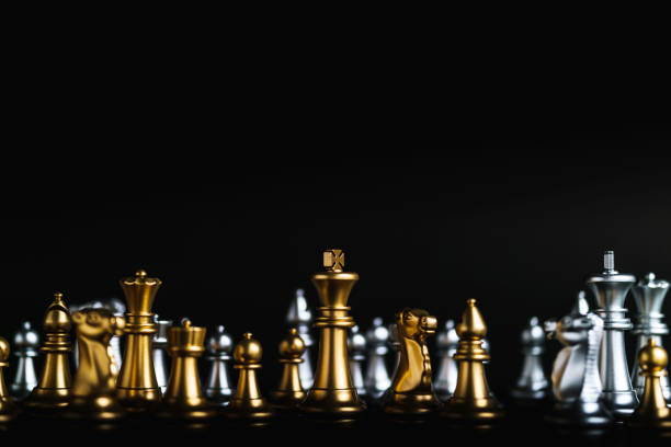 istock business game competitive strategy with chess board game on black table 1010327464