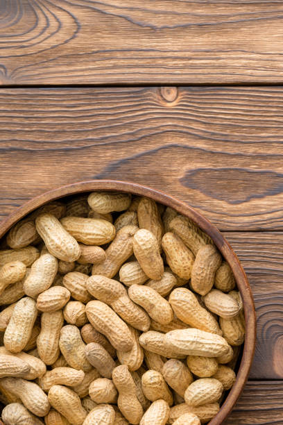 istock Bowl of healthy natural raw peanuts in shells 1010329562