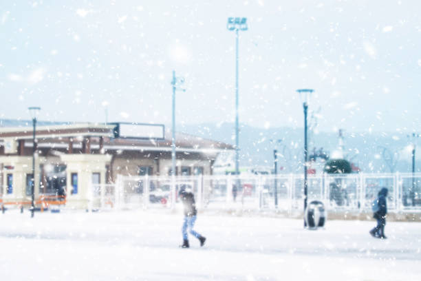 Blur snowy city background Blur snowy city background slippery unrecognizable person safety outdoors stock pictures, royalty-free photos & images