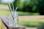 Reusable glass jar full of stainless steel straws