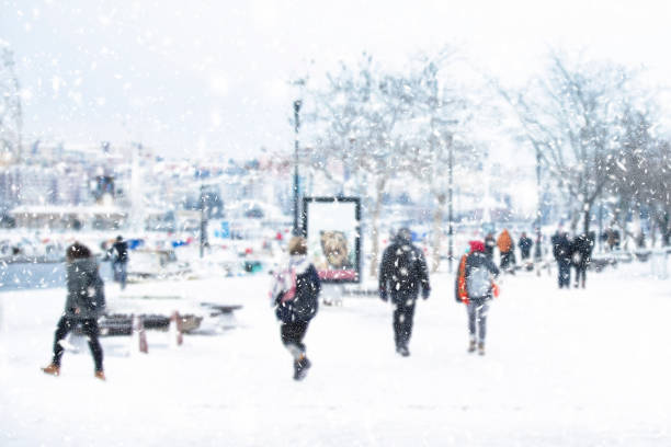 istock Blur snowy city background with people 1010343094
