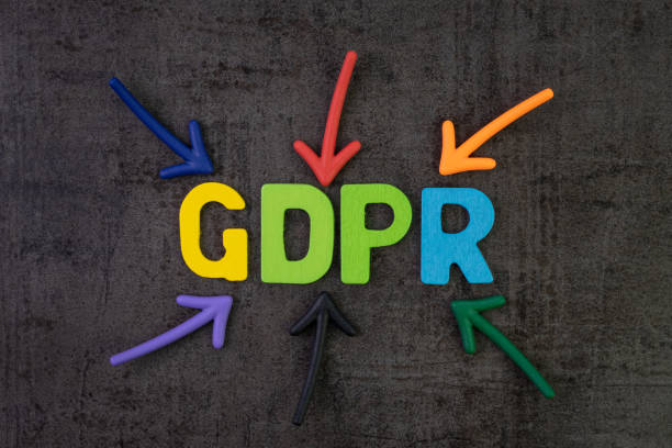 GDPR, General Data Protection Regulation concept, colorful arrows pointing to the word GDPR at the center of black cement chalkboard wall, important Europe data privacy regulation, rights of use law. gdpr, reglamento de protección de datos general concepto, coloridas flechas apuntando a la palabra gdpr en el centro de la pared de cemento negro pizarra, importante reglamento de privacidad de datos de europa, los derechos de la ley de uso