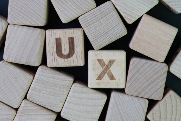 istock UX, User Experience design concept, cube wooden block combine word UX, development of a journey and interaction between product or service and customer or consumer 1010364802