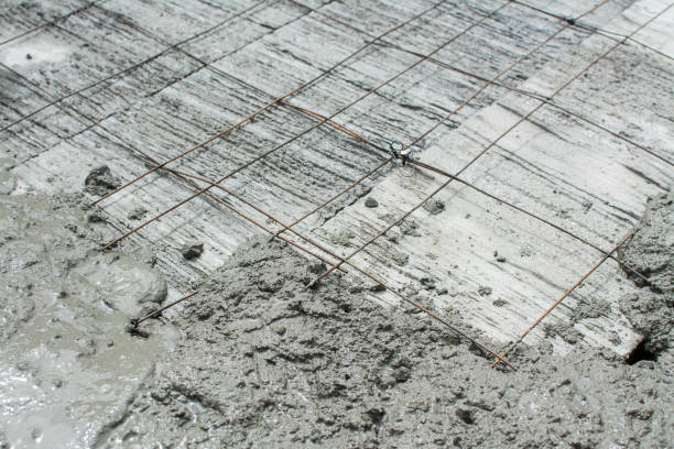 istock The wet concrete is poured on wire mesh steel reinforcement 1010375416